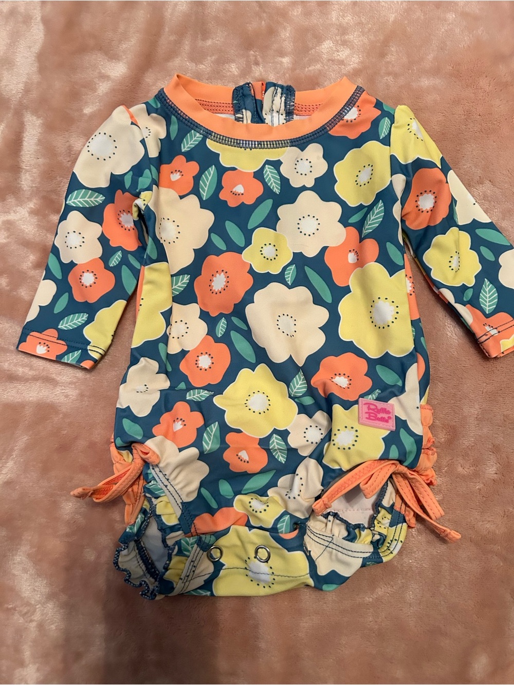 Ruffle Butts Teal Floral Long Sleeve Rashguard with Coral and Yellow Accents